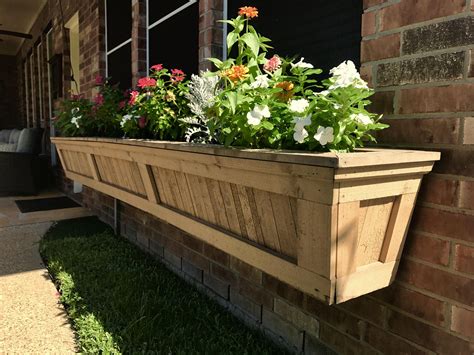 wooden flower boxes under window